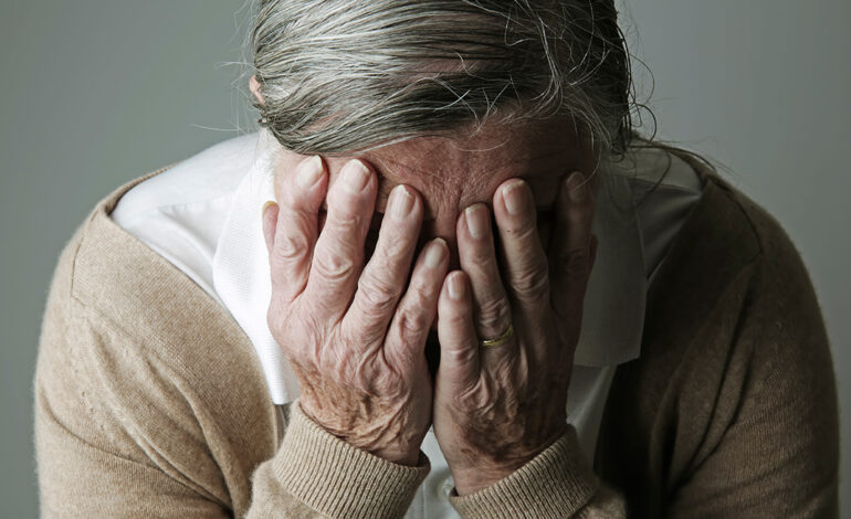 1140 alzheimer myths woman hiding face esp